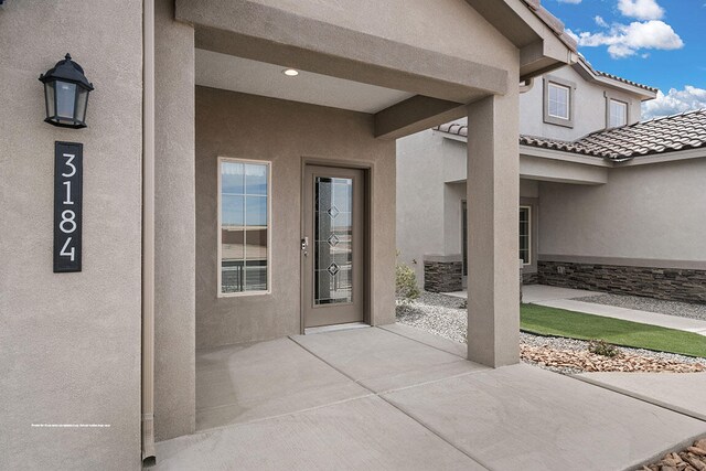 property entrance featuring central AC