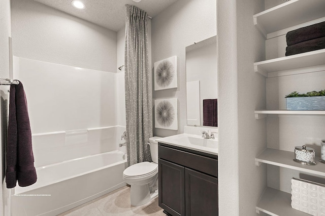 full bathroom featuring shower / bathing tub combination, vanity, toilet, and a textured ceiling