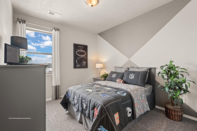 carpeted bedroom with a textured ceiling