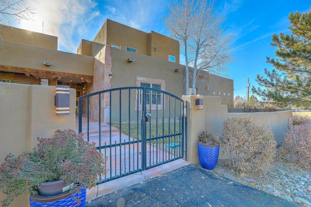 view of gate featuring a fenced front yard