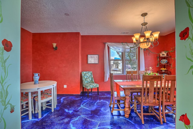 dining room featuring a chandelier, a textured ceiling, and dark colored carpet