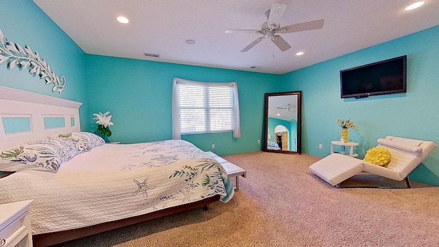 carpeted bedroom featuring recessed lighting, visible vents, and ceiling fan