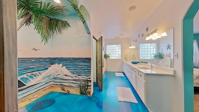 bathroom with vanity and a textured ceiling