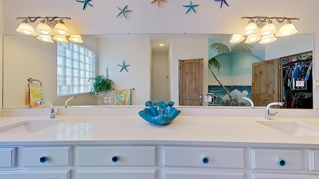 bathroom with vanity and a notable chandelier