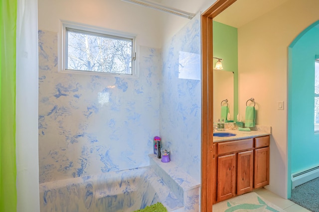 bathroom with a baseboard heating unit, tile patterned flooring, and vanity