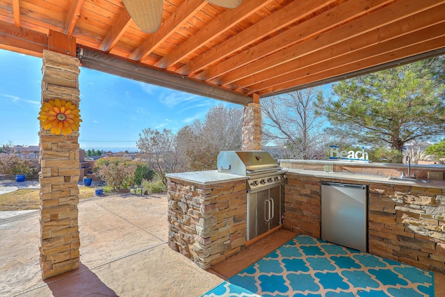 view of patio / terrace with grilling area, a sink, and area for grilling