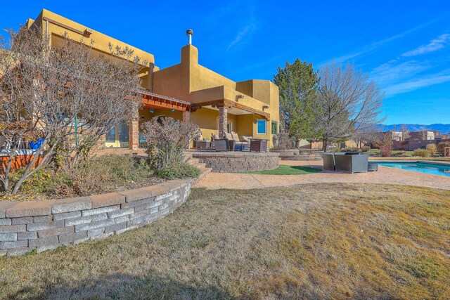 view of patio / terrace featuring sink, grilling area, and exterior kitchen