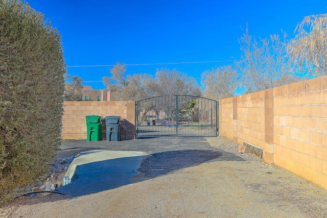 view of gate featuring fence