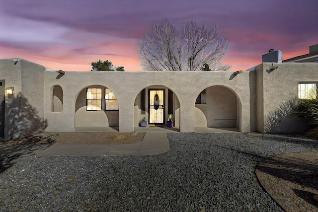 view of pueblo revival-style home