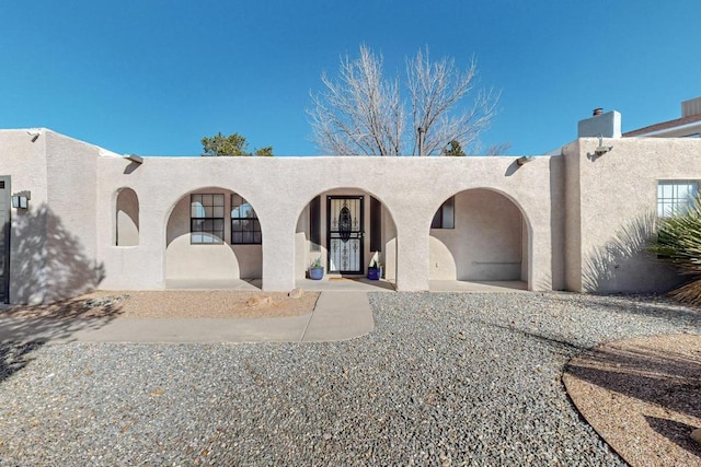 view of pueblo revival-style home