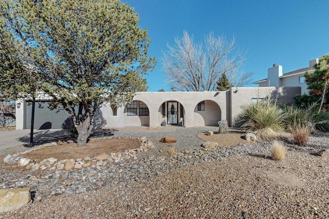 adobe home with a garage