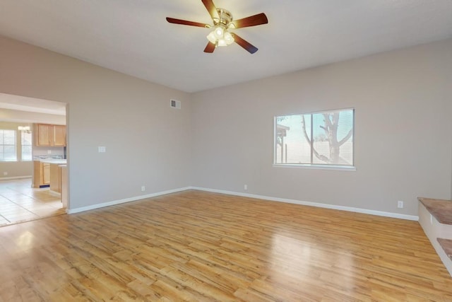 unfurnished room featuring ceiling fan and light hardwood / wood-style floors