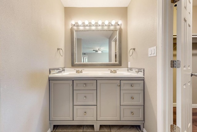 bathroom featuring tile patterned flooring and vanity