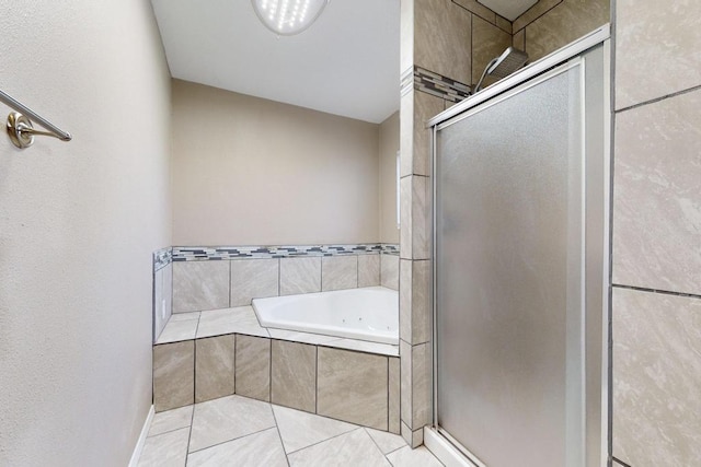 bathroom with tile patterned flooring and separate shower and tub