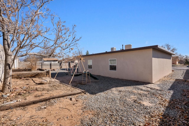 back of property with cooling unit