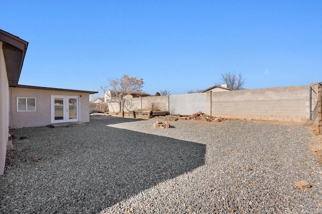 view of yard with french doors