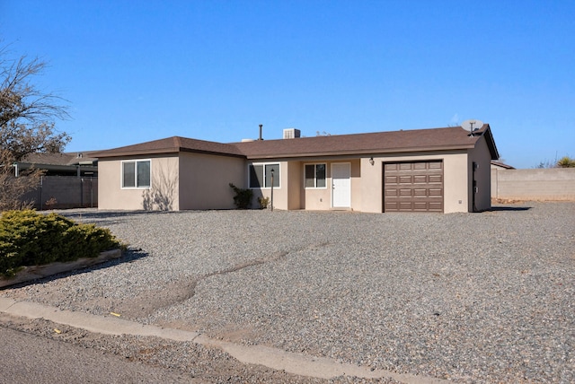 single story home featuring a garage