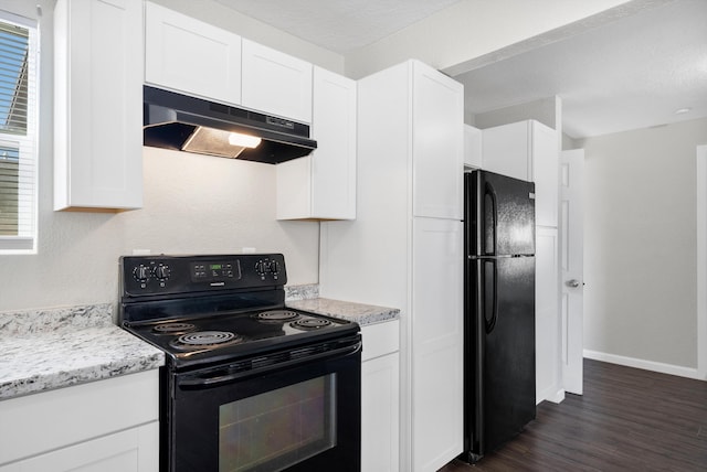 kitchen featuring white cabinets, dark hardwood / wood-style flooring, light stone counters, and black appliances