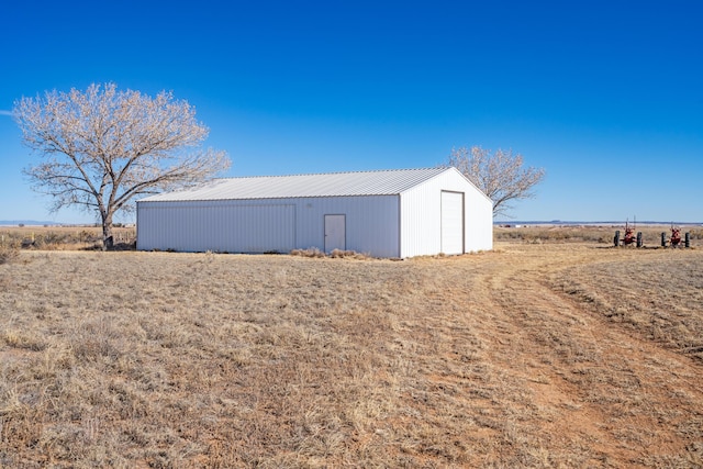 view of outdoor structure featuring a rural view