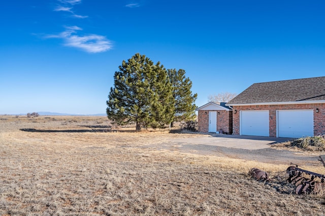 view of yard featuring a garage