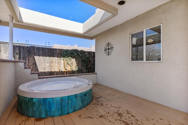 view of patio / terrace with a hot tub