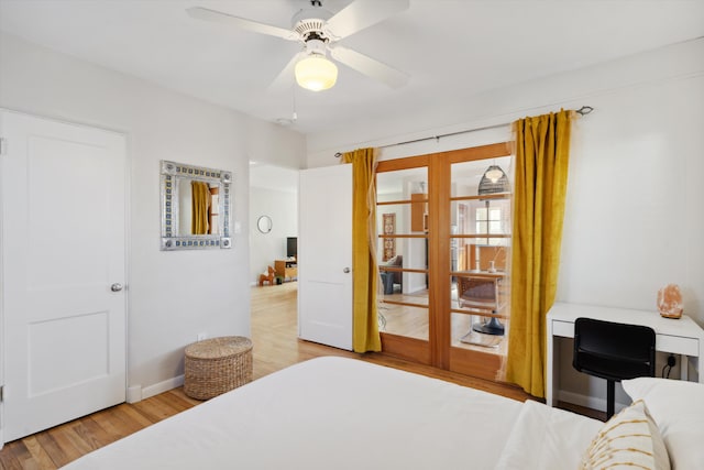 bedroom with ceiling fan, french doors, and light hardwood / wood-style flooring