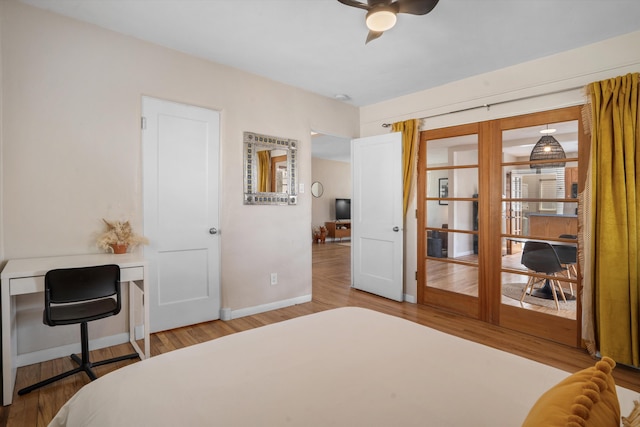 bedroom featuring baseboards and wood finished floors