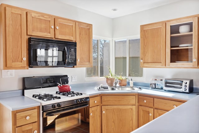 kitchen featuring white gas range and sink