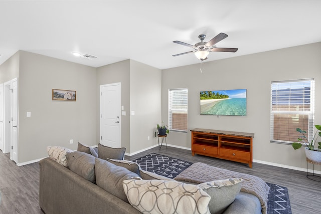 living room with ceiling fan and dark hardwood / wood-style floors