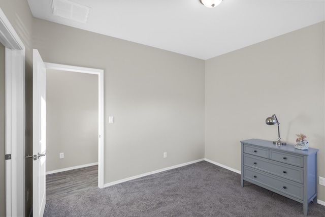 unfurnished bedroom featuring dark colored carpet