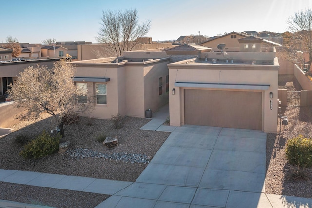 adobe home featuring a garage