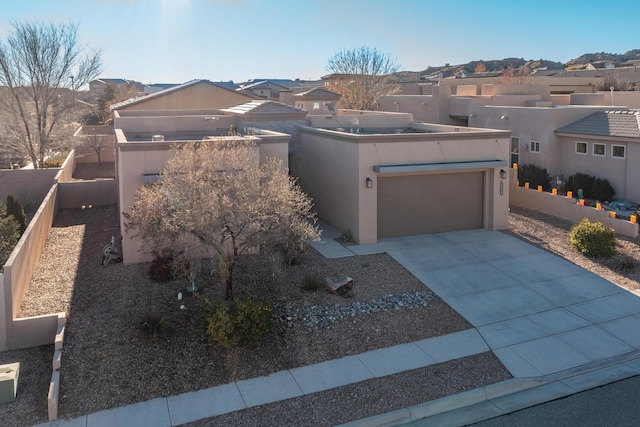 southwest-style home with a garage