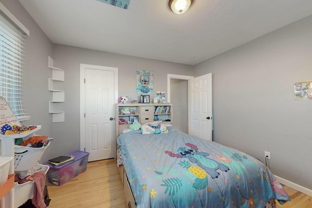 bedroom with light wood-type flooring