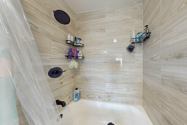 bathroom with shower / bathtub combination with curtain