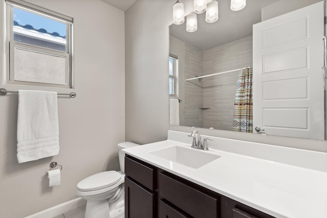 bathroom featuring a shower with shower curtain, vanity, and toilet