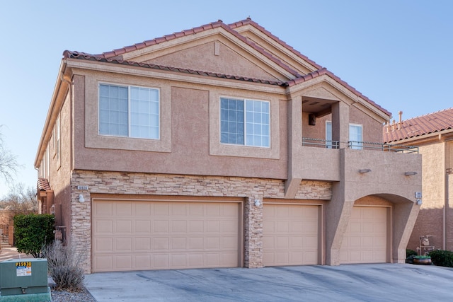 view of front of house with a balcony and a garage