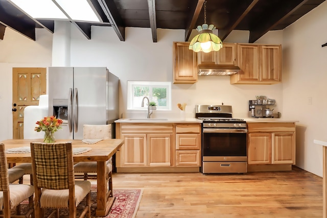 kitchen with under cabinet range hood, stainless steel appliances, a sink, light countertops, and beam ceiling