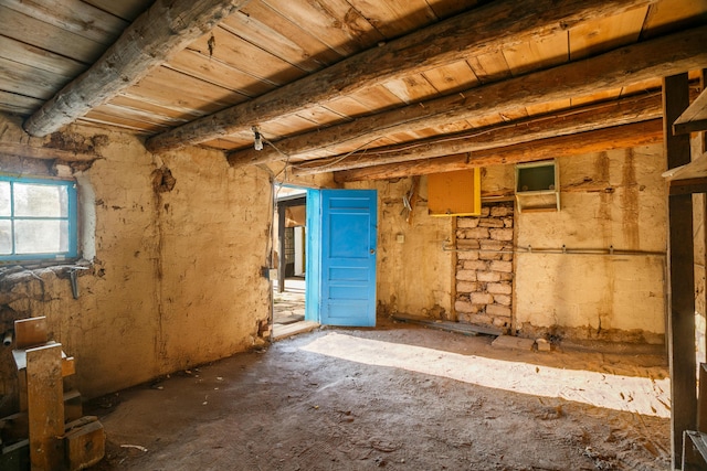 miscellaneous room featuring wood ceiling and beam ceiling