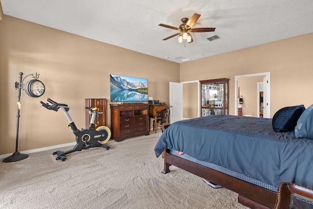 bedroom featuring light carpet and ceiling fan