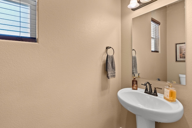 bathroom with toilet and sink