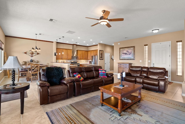 living area featuring light tile patterned floors, baseboards, visible vents, and a textured ceiling