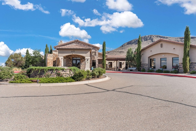 view of front of home featuring a mountain view