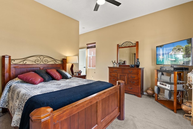 bedroom featuring light carpet, ceiling fan, and lofted ceiling