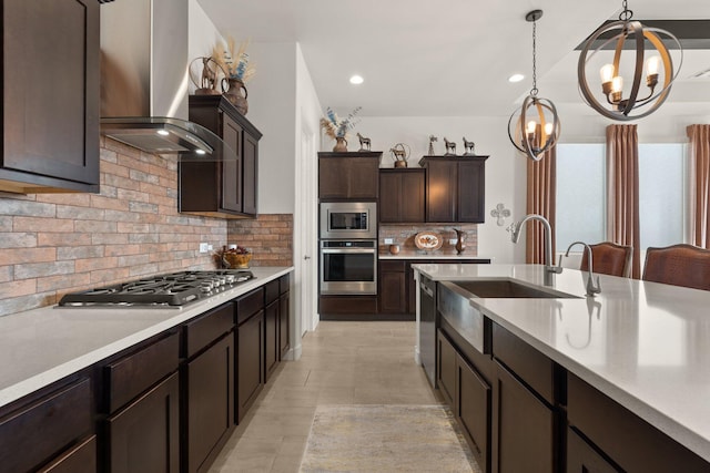 kitchen featuring a sink, dark brown cabinetry, stainless steel appliances, light countertops, and ventilation hood