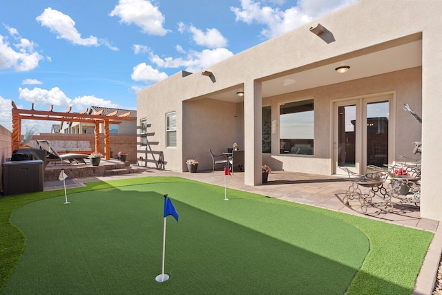 6816 Cleary Loop NE, Rio Rancho, NM 87144 - view of yard featuring a putting green, a patio, and a pergola