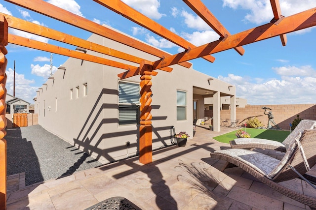 view of patio / terrace featuring a pergola and a fenced backyard