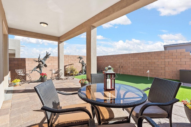 view of patio / terrace with a fenced backyard and outdoor dining area