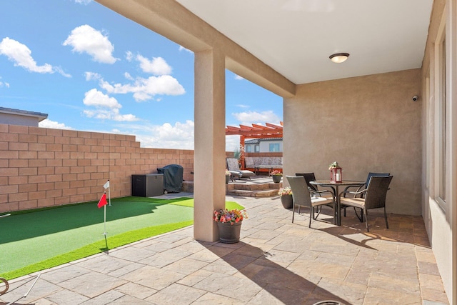 view of patio with fence, outdoor dining area, and a pergola