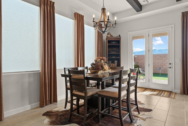 dining room featuring a chandelier, tile patterned floors, beam ceiling, and baseboards