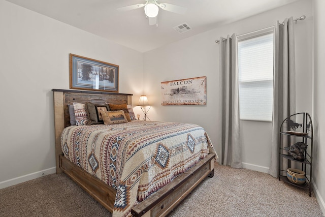 bedroom with visible vents, light carpet, and baseboards